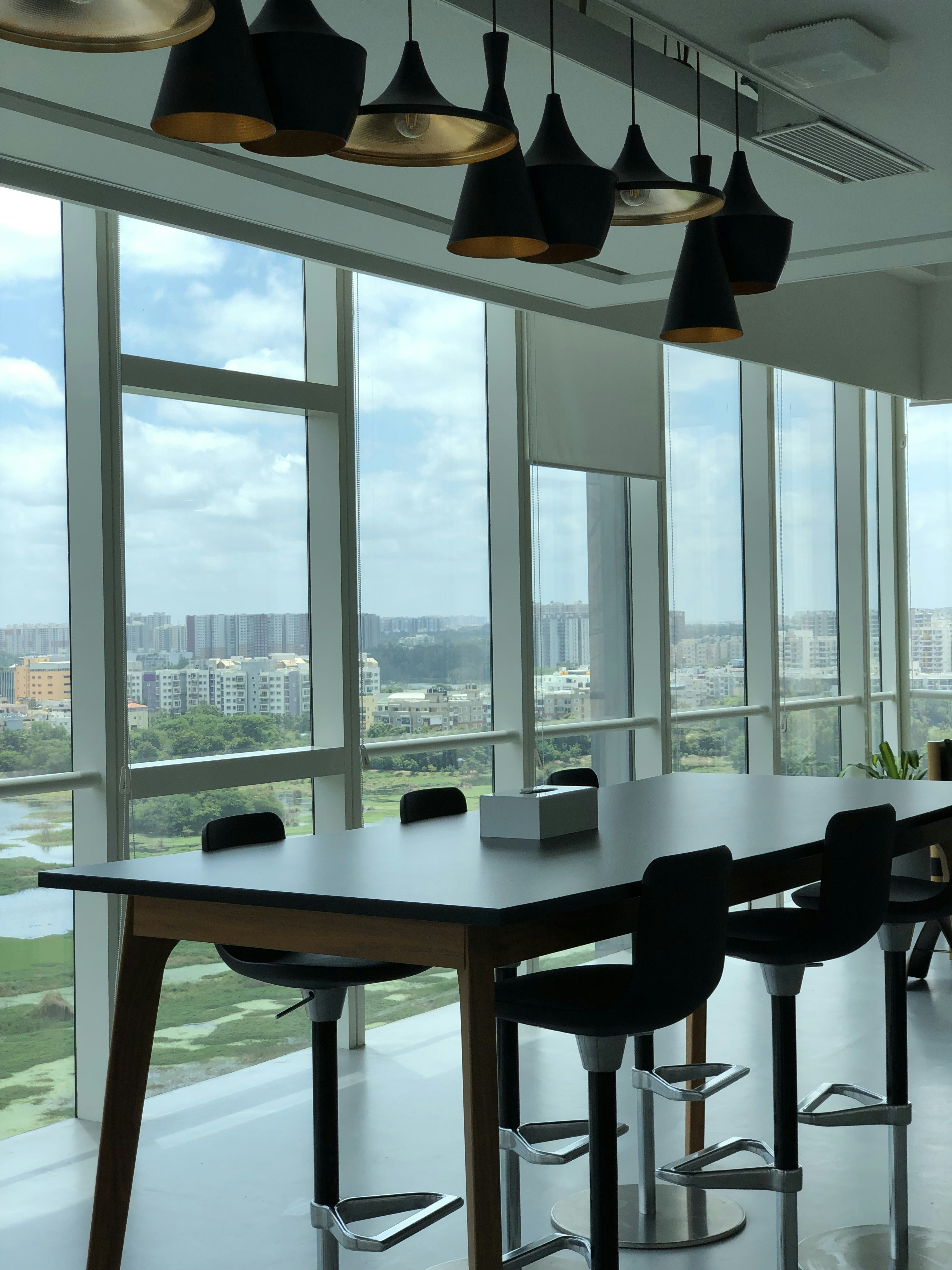 Professional discussing plans in a modern office with a city view